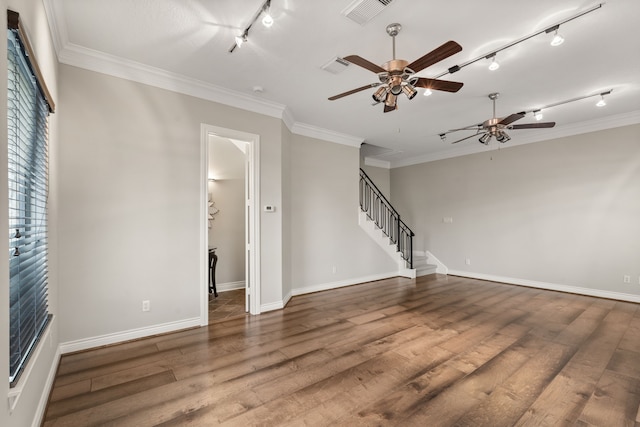 unfurnished living room with ceiling fan, ornamental molding, and wood-type flooring