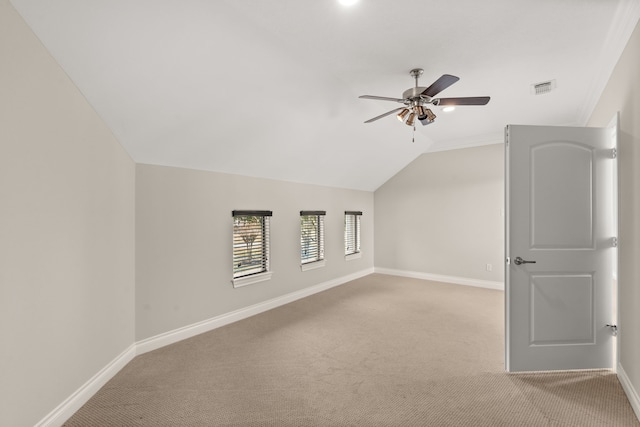 bonus room featuring vaulted ceiling, light colored carpet, and ceiling fan