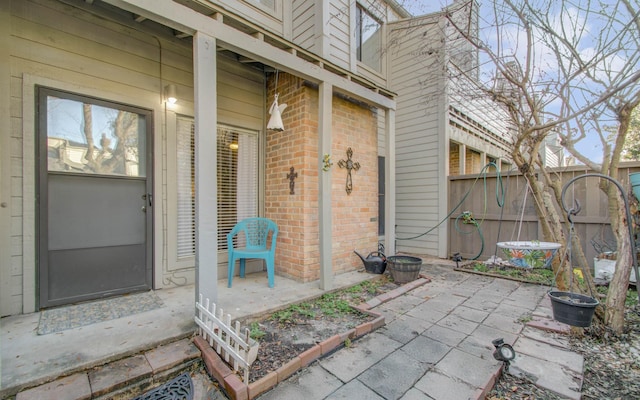 property entrance featuring a patio