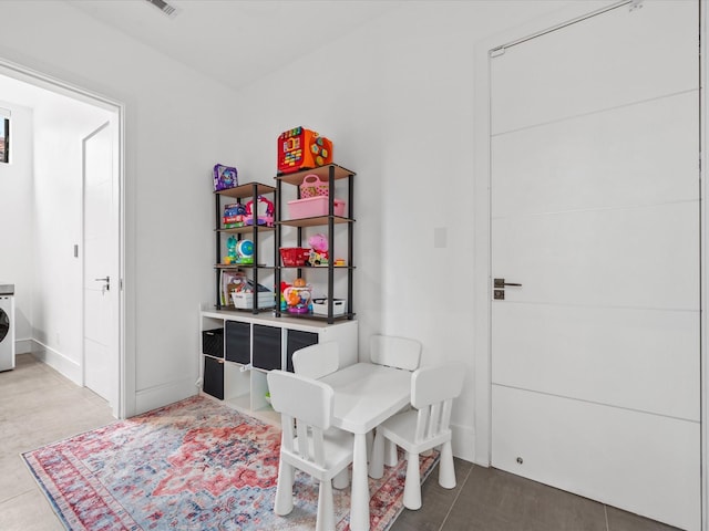 interior space with washer / clothes dryer and baseboards