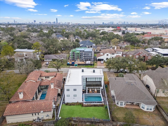 birds eye view of property with a view of city