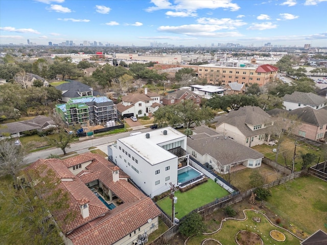 birds eye view of property with a view of city