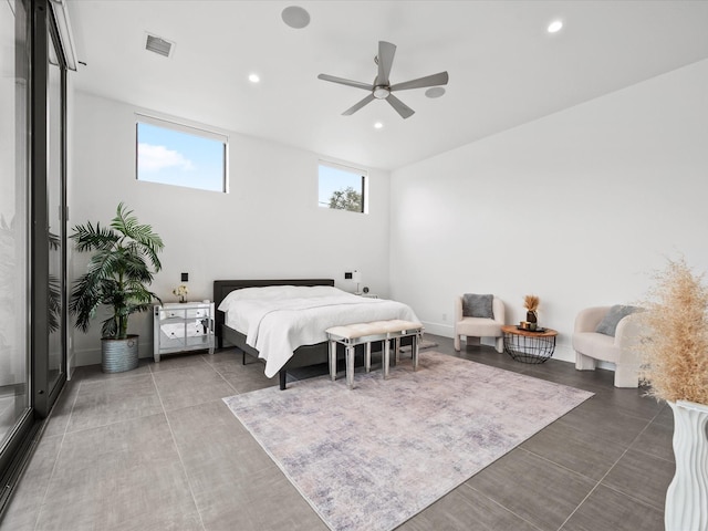 bedroom featuring a ceiling fan, dark tile patterned floors, visible vents, and recessed lighting