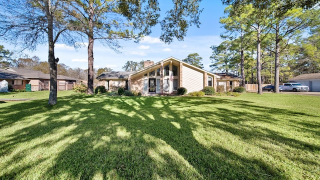 view of side of home featuring a lawn