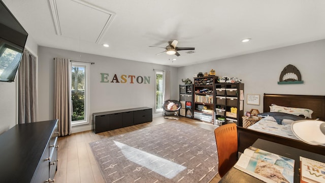 bedroom with ceiling fan and light wood-type flooring