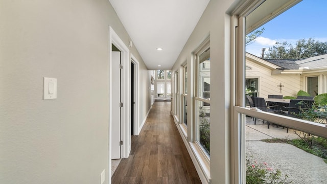 hallway with dark wood-type flooring