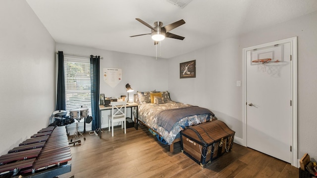 bedroom featuring wood-type flooring and ceiling fan