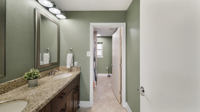 bathroom with tile patterned flooring and vanity