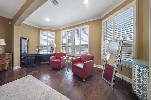 living area featuring dark wood-type flooring and ornamental molding