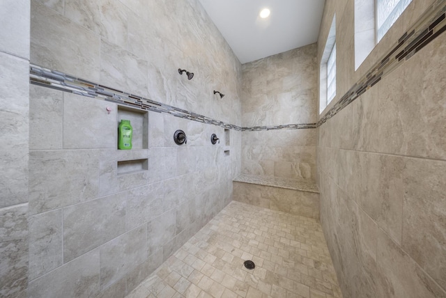 bathroom featuring a tile shower