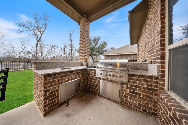 view of patio / terrace with area for grilling, exterior kitchen, and sink