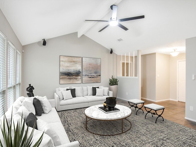 tiled living room with ceiling fan and lofted ceiling with beams