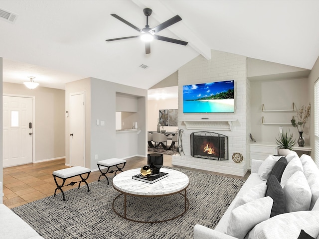 living room with ceiling fan, tile patterned flooring, a brick fireplace, and vaulted ceiling with beams