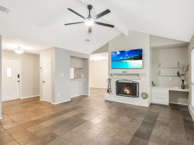 unfurnished living room with a fireplace, lofted ceiling with beams, and ceiling fan