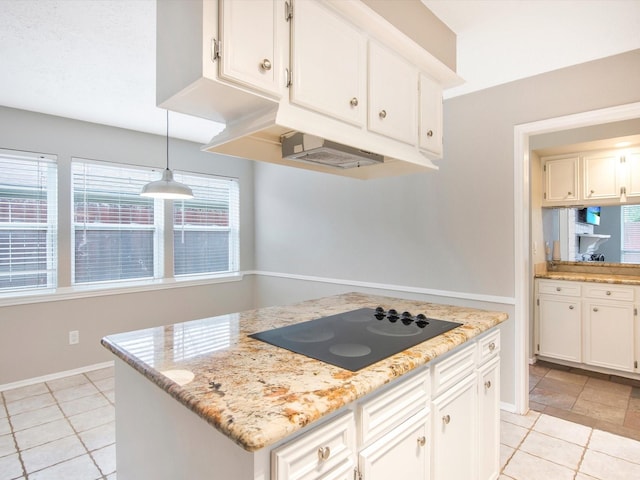 kitchen with light tile patterned floors, white cabinetry, a center island, black electric cooktop, and decorative light fixtures