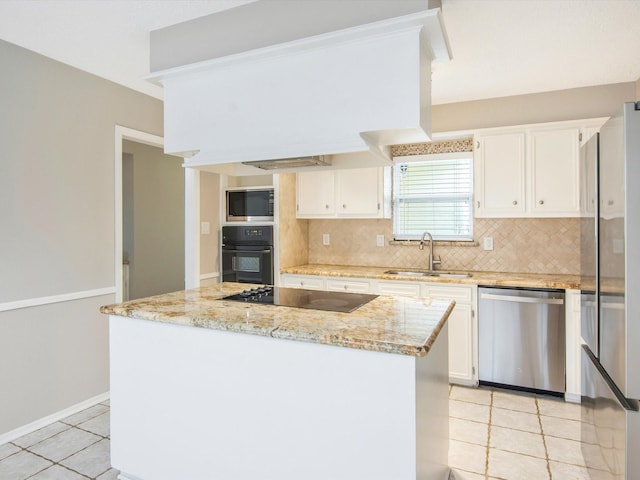 kitchen featuring sink, white cabinets, light stone counters, and black appliances