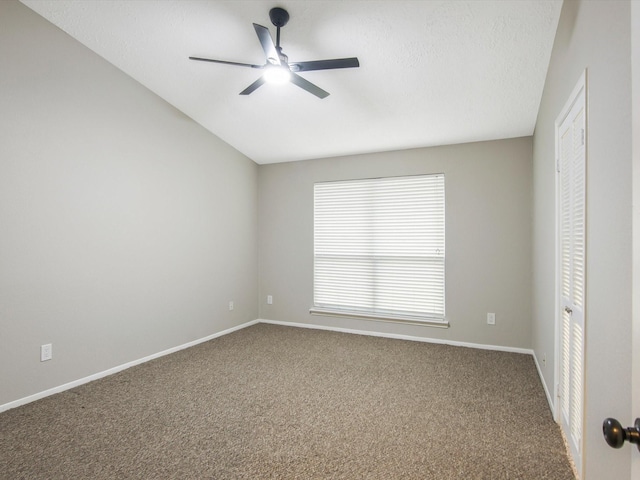 empty room featuring carpet floors and ceiling fan