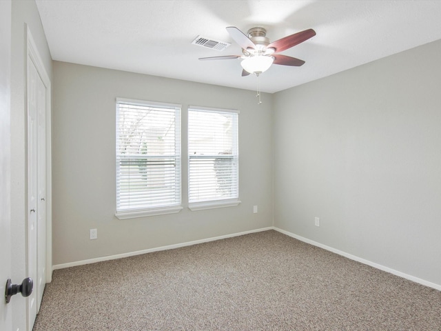 carpeted empty room with ceiling fan