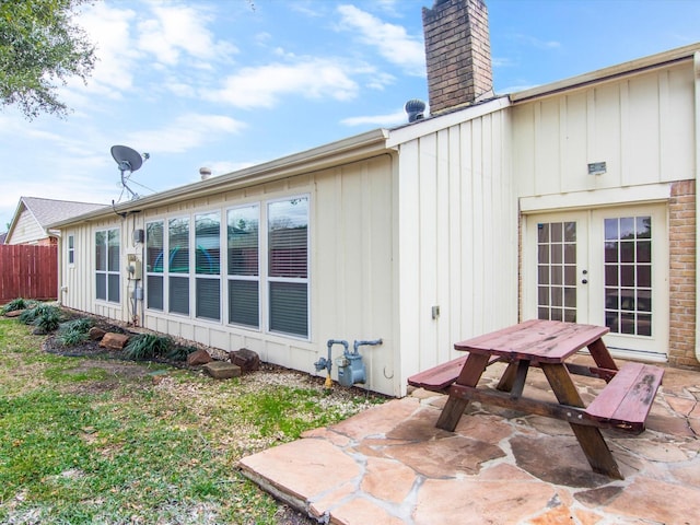 rear view of house with french doors and a patio