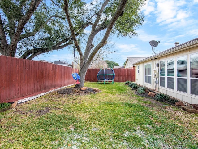 view of yard with a trampoline