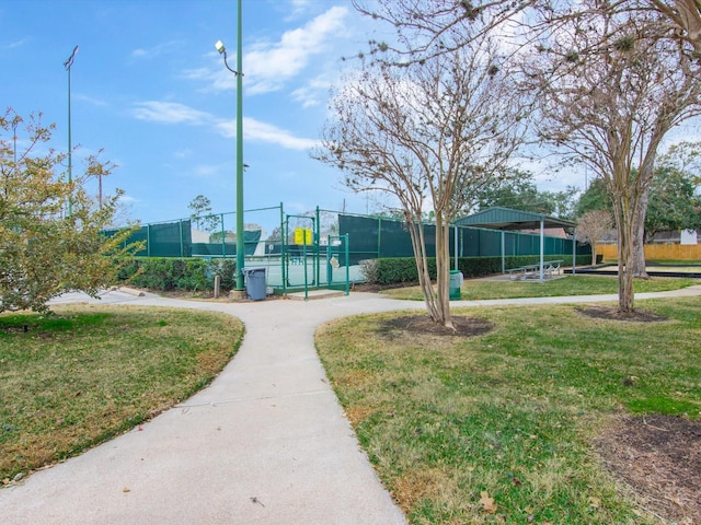 view of property's community with a lawn