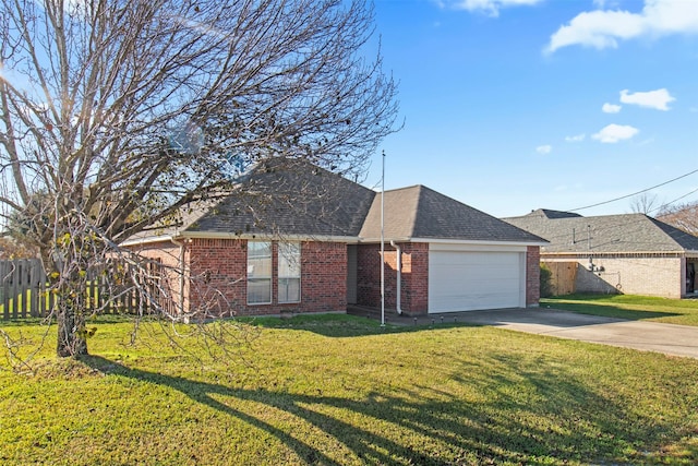 ranch-style home featuring a garage and a front yard