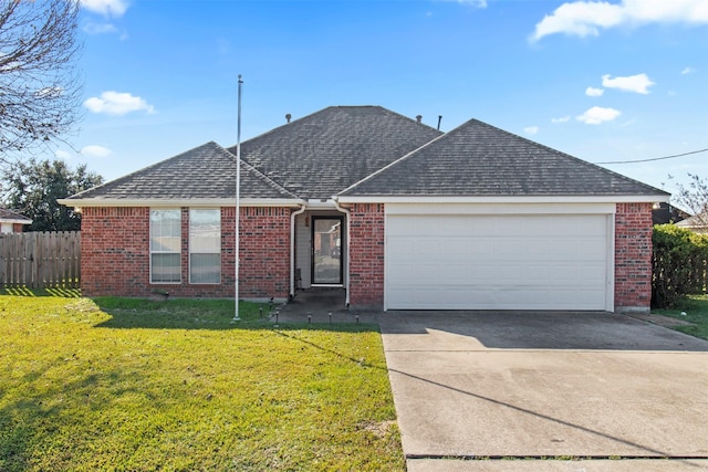 ranch-style home with a garage and a front yard