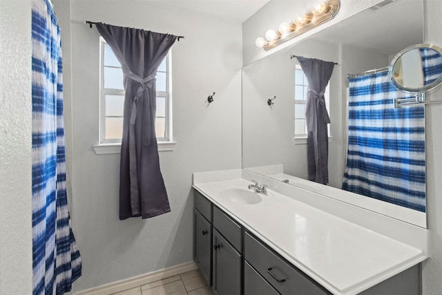 bathroom with vanity and tile patterned flooring