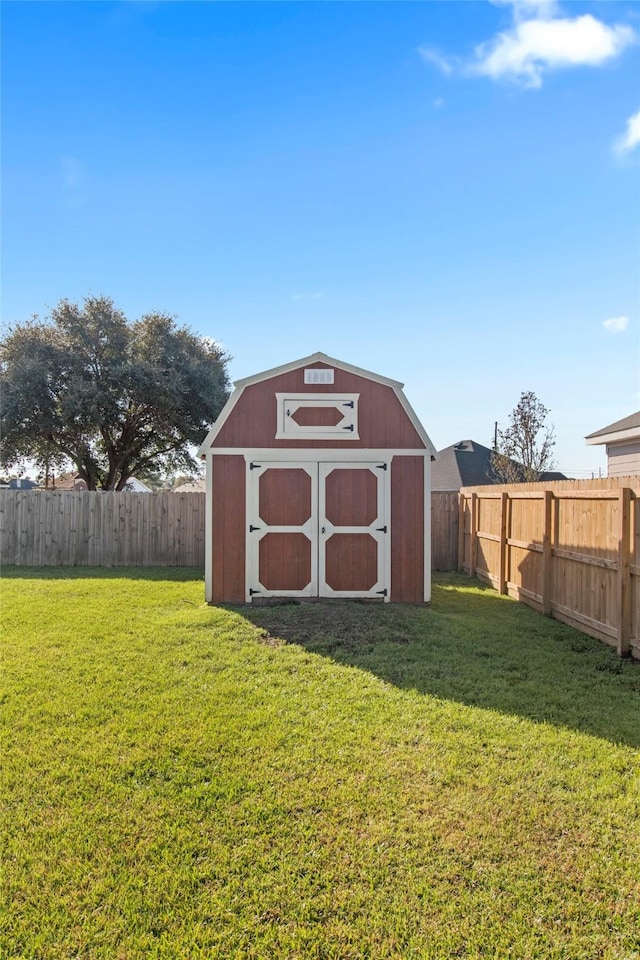 view of outbuilding with a yard