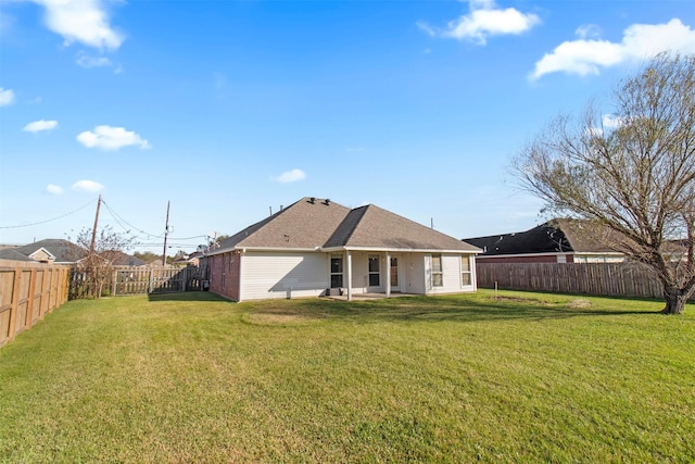 back of house with a yard