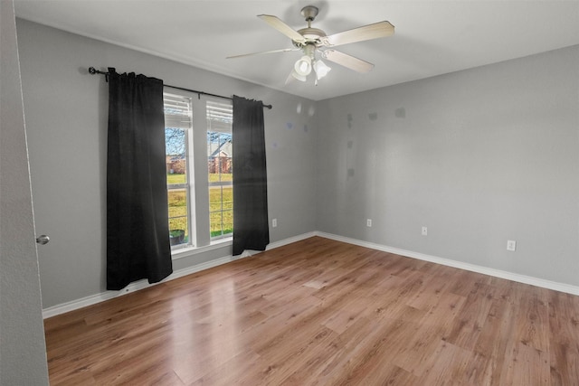 spare room with light hardwood / wood-style floors and ceiling fan