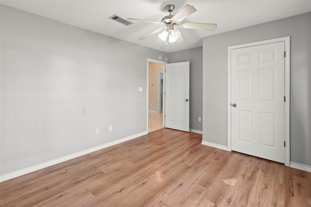 unfurnished bedroom with light hardwood / wood-style flooring and ceiling fan