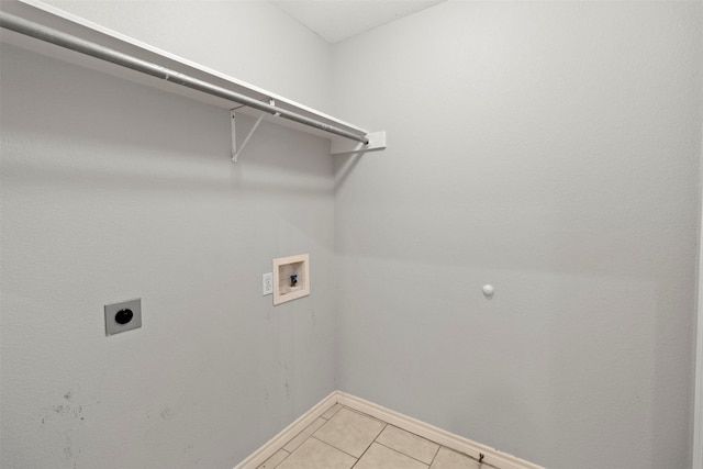 laundry area featuring tile patterned flooring, electric dryer hookup, and washer hookup