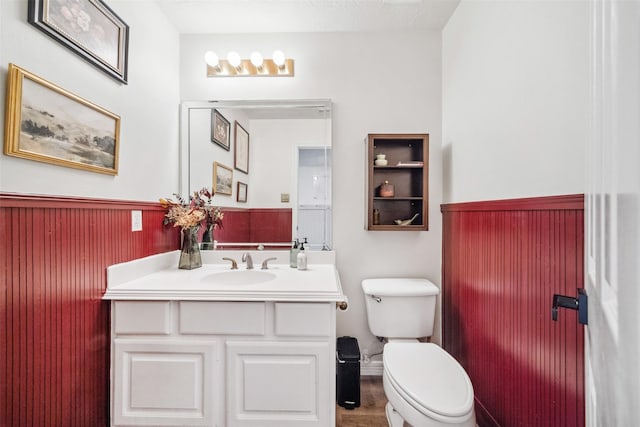 bathroom featuring vanity and toilet