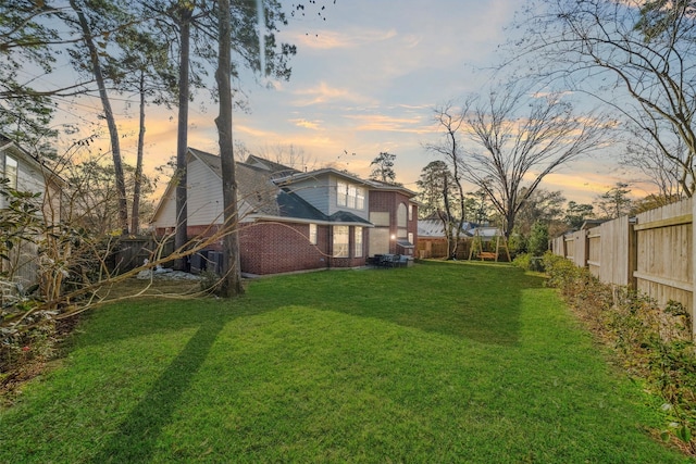 view of yard at dusk