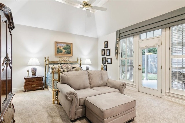 carpeted bedroom with ceiling fan, lofted ceiling, and access to exterior