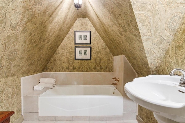 bathroom featuring a tub and sink