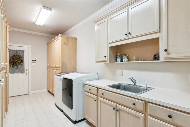 laundry area featuring separate washer and dryer, sink, crown molding, and cabinets