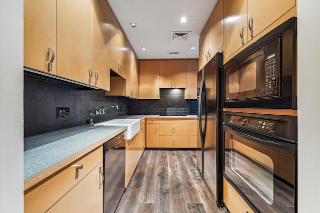 kitchen featuring sink, light brown cabinetry, backsplash, black appliances, and dark hardwood / wood-style flooring