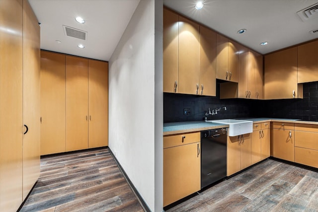 kitchen featuring light brown cabinetry, sink, tasteful backsplash, dark hardwood / wood-style flooring, and dishwasher