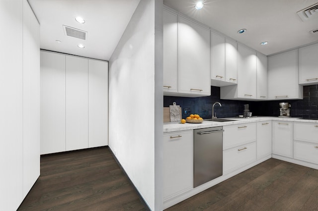 kitchen featuring sink, dishwasher, dark hardwood / wood-style floors, and white cabinets