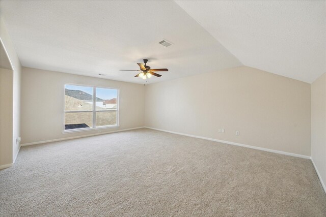 interior space featuring vaulted ceiling and ceiling fan