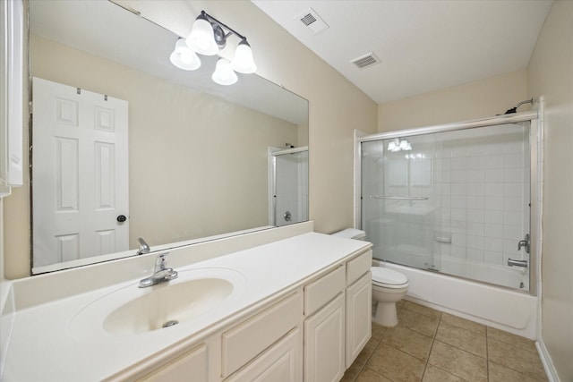 full bathroom featuring enclosed tub / shower combo, tile patterned flooring, vanity, toilet, and a chandelier