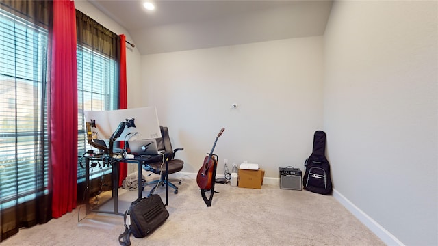 office space with lofted ceiling and carpet floors