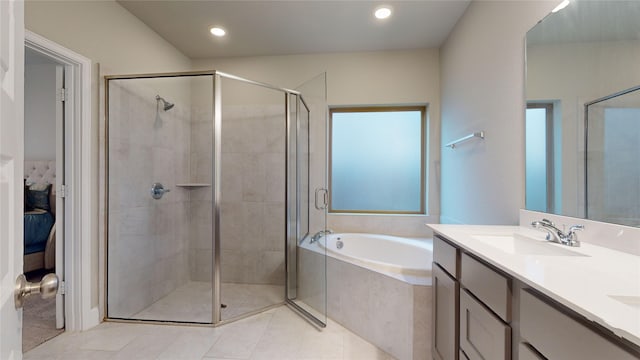 bathroom featuring vanity, tile patterned floors, and plus walk in shower