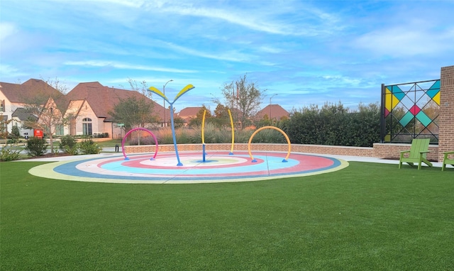 view of basketball court featuring a yard