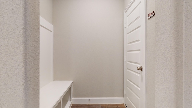 mudroom with wood-type flooring