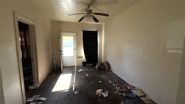 interior space featuring ceiling fan