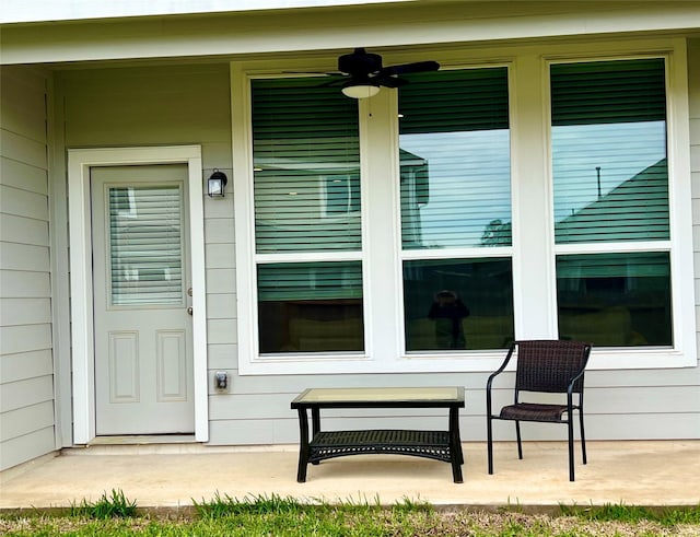 entrance to property featuring ceiling fan