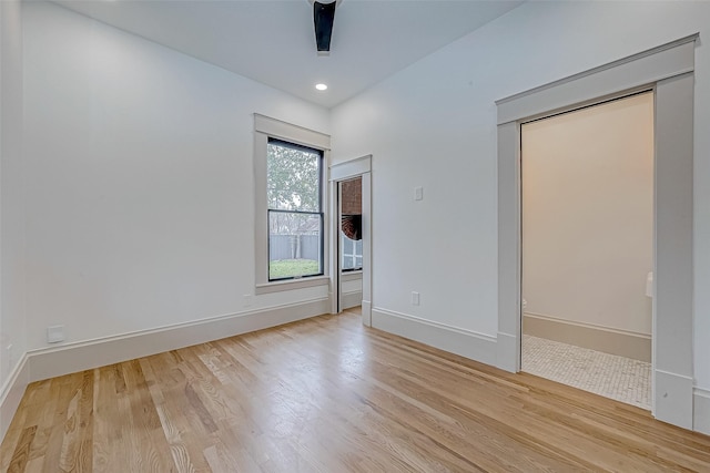 unfurnished bedroom featuring ceiling fan and light wood-type flooring